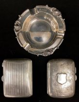 A silver cigarette case, Birmingham 1921; another Chester 1922; Ashtray, Sheffield 1965, 5.7ozt (3)