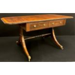 A George III mahogany sofa table; crossbanded rounded rectangular top above a pair of drawers to