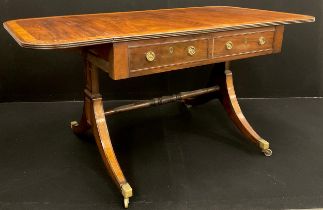 A George III mahogany sofa table; crossbanded rounded rectangular top above a pair of drawers to