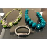 Jewellery - a plaited grey leather bracelet, USB style clasp; two bead necklaces in tones of