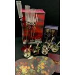 A set of six Krasno Glass champagne flutes in spiral stand, and six spares, metal mount glass