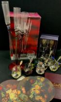 A set of six Krasno Glass champagne flutes in spiral stand, and six spares, metal mount glass