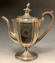 A George III silver coffee pot, with shaped tapering oval body bright-cut engraved with formal