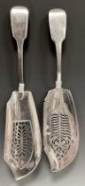 A George IV silver fish slice, Thomas Sowerby, London 1822; another William Elliott, London 1822,