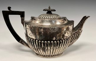 A George V silver teapot, gadrooned body, ebony handle, James Deakin & Sons (John & William F
