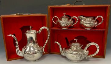 A Chinese silver four piece tea and coffee service, comprising teapot, coffee pot, milk jug and