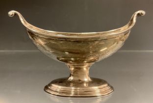 A George III silver boat shape open salt, scrolled ends, gilt interior, spreading stepped feet,