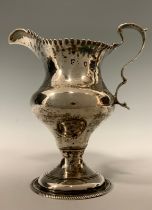A George III silver cream jug, makers marks worn possibly J K, Chester 1780, 90.0g, 11cm high