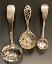 A George III silver oval bowl straining spoon, Thomas James, London 1808; spice or sugar straining