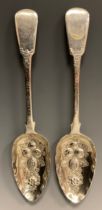 A pair of George III silver embossed berry spoons, BA, London 1811, 4.92ozt (2)