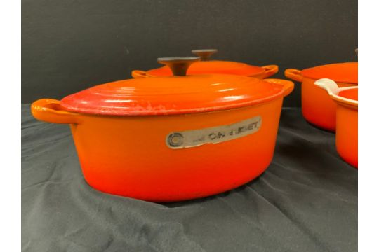 Le Creuset - four cast iron lidded pots, volcanic pattern including; two round casserole pots, - Image 4 of 7