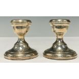 A pair of Elizabeth II silver boudoir candlesticks, Birmingham 1966, boxed