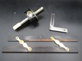 An Edwardian scriber, set square and parallel rule
