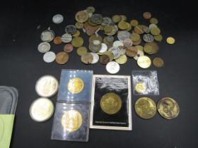 A box of about 50 coins and medallions with 5 gold plated? medals and token 'spade'