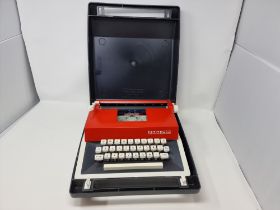 Petite International Deluxe Typewriter and case.