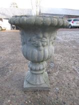 A concrete garden urn