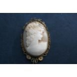 A  shell cameo with gilded filigree work