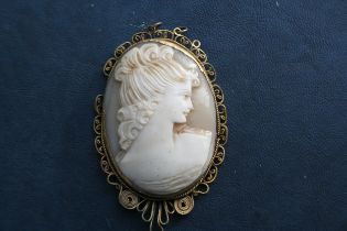 A  shell cameo with gilded filigree work