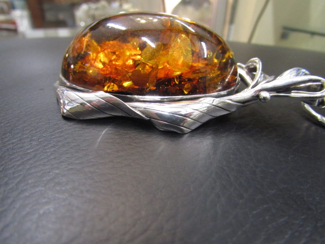 A large re-constituted Amber and Polish silver pendant 10cm long stamped 925 - Image 4 of 4