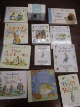 Peter Rabbit books along with a Wedgwood Peter Rabbit money box