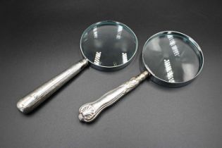 2 Silver handled magnifying glasses, hallmarks very rubbed, largest 18cm long, smallest 17.5cm long.