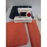 Child's Singer sewing machine with 2 amounts of fabric
