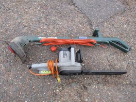 Titan electric chainsaw and Black & Decker strimmer both from a house clearance