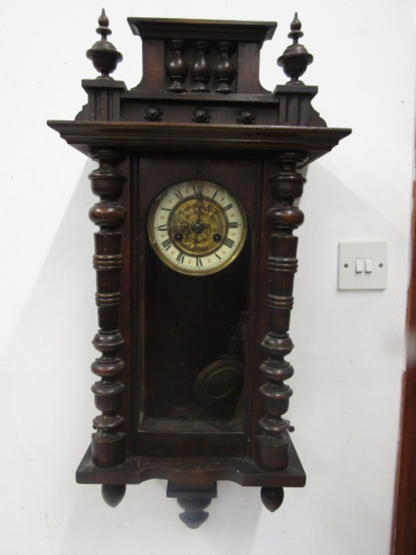 Wall clock with pendulum