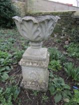 Concrete garden urn on plinth. H80cm approx  (urn is cracked)