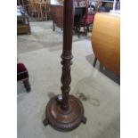 A wooden standard lamp