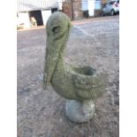 A concrete pelican plant pot holder/ planter