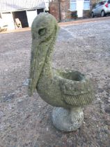 A concrete pelican plant pot holder/ planter