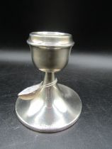 A silver weighted candlestick