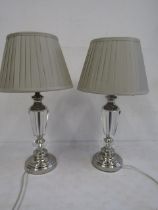 A pair glass lamps with pleated grey shades