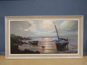 Oil on canvas of a coastal scene, signed bottom right and framed 73cm x 133cm approx