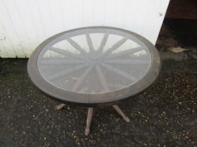 A wooden wheel coffee table with glass top 70cm diameter