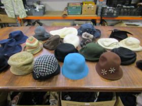 A quantity of hats inc Kangol, Laura Ashley etc