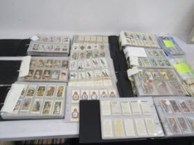 A large cigarette card collection to include many full sets dating back to the early 1920's to