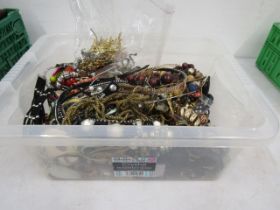 A crate of costume jewellery with a jewellery box