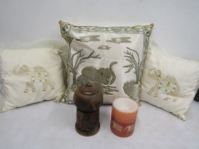 Treen carved elephant lidded pot, candle and 3 cushions with elephants