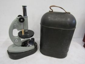 Vintage microscope in metal case