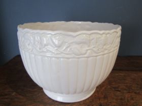 A white ceramic planter 25cmH 34cm Dia