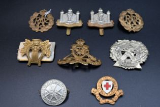 9 assorted British cap badges etc
