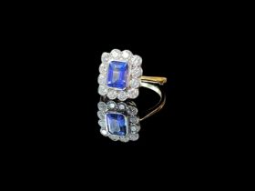 18ct gold art deco style sapphire and diamond ring, a large emerald cut sapphire (1 carat) in the