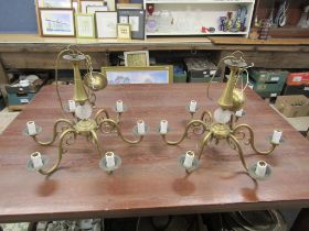 Pair of heavy brass and cut glass chandeliers