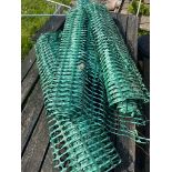 Quantitiy of green plastic barrier fencing