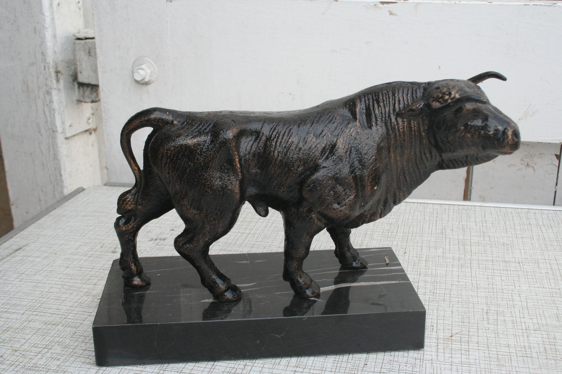 Bull figure on marble base