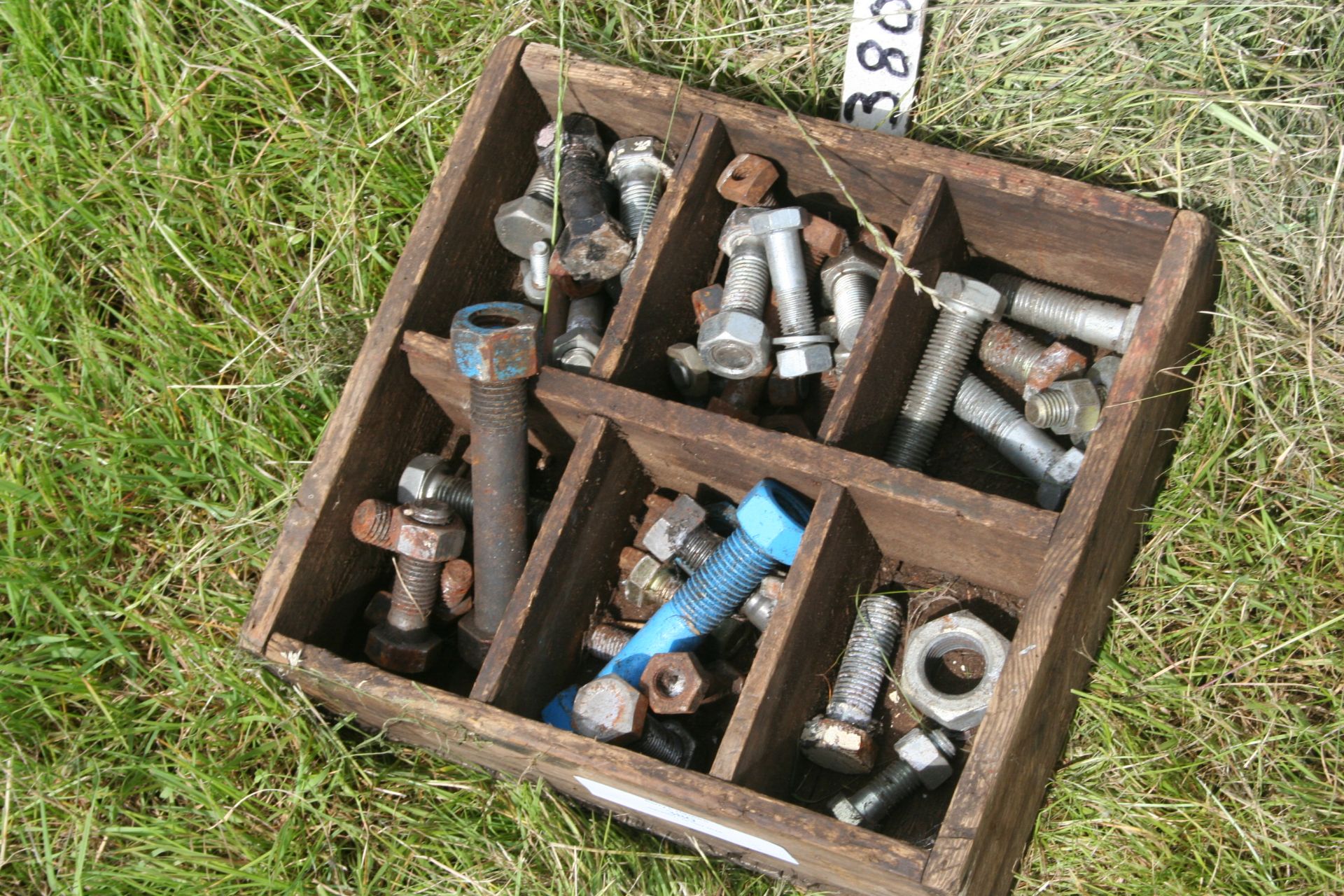 wooden box of bolts