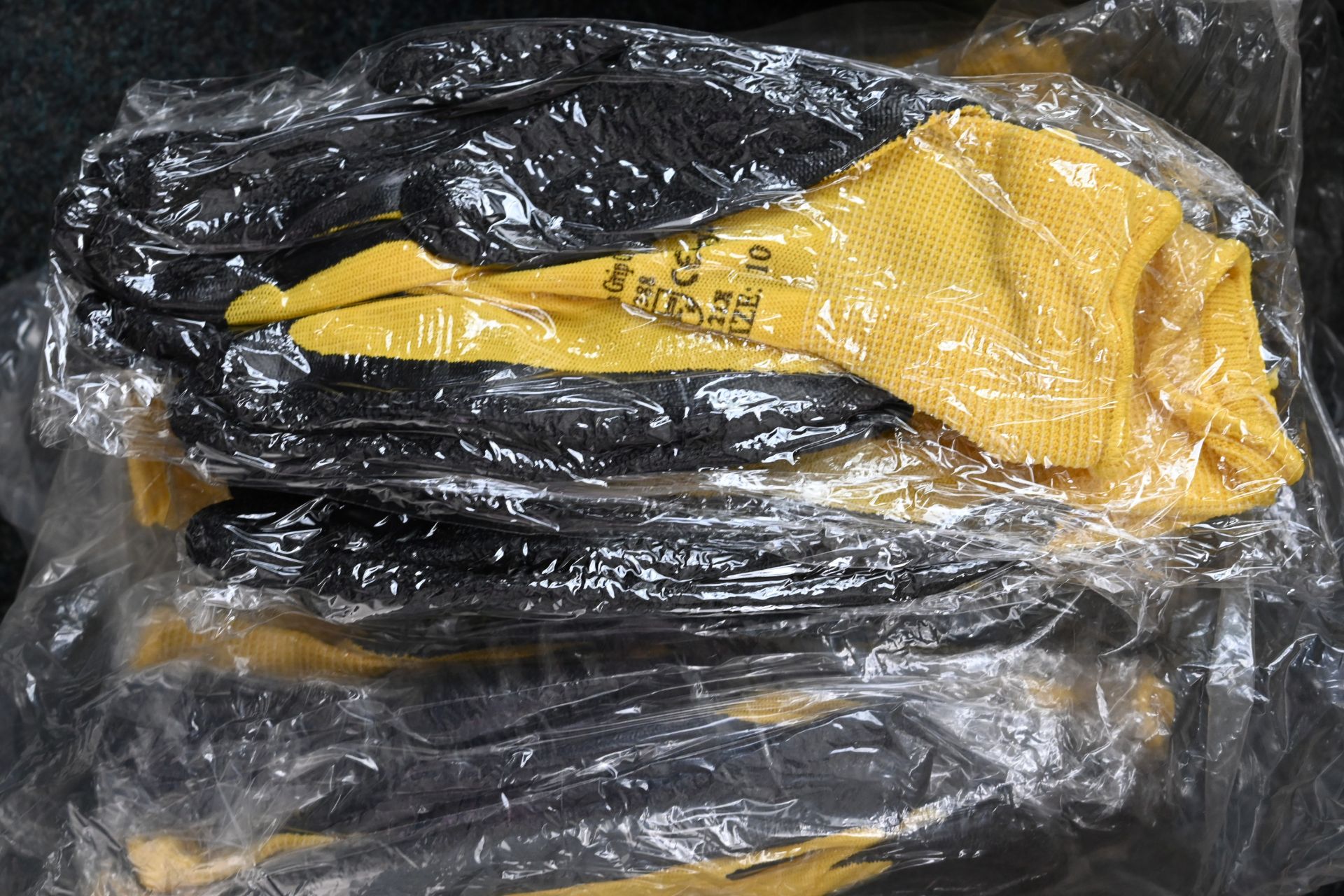 12 pairs of yellow and black nitrile coated gloves