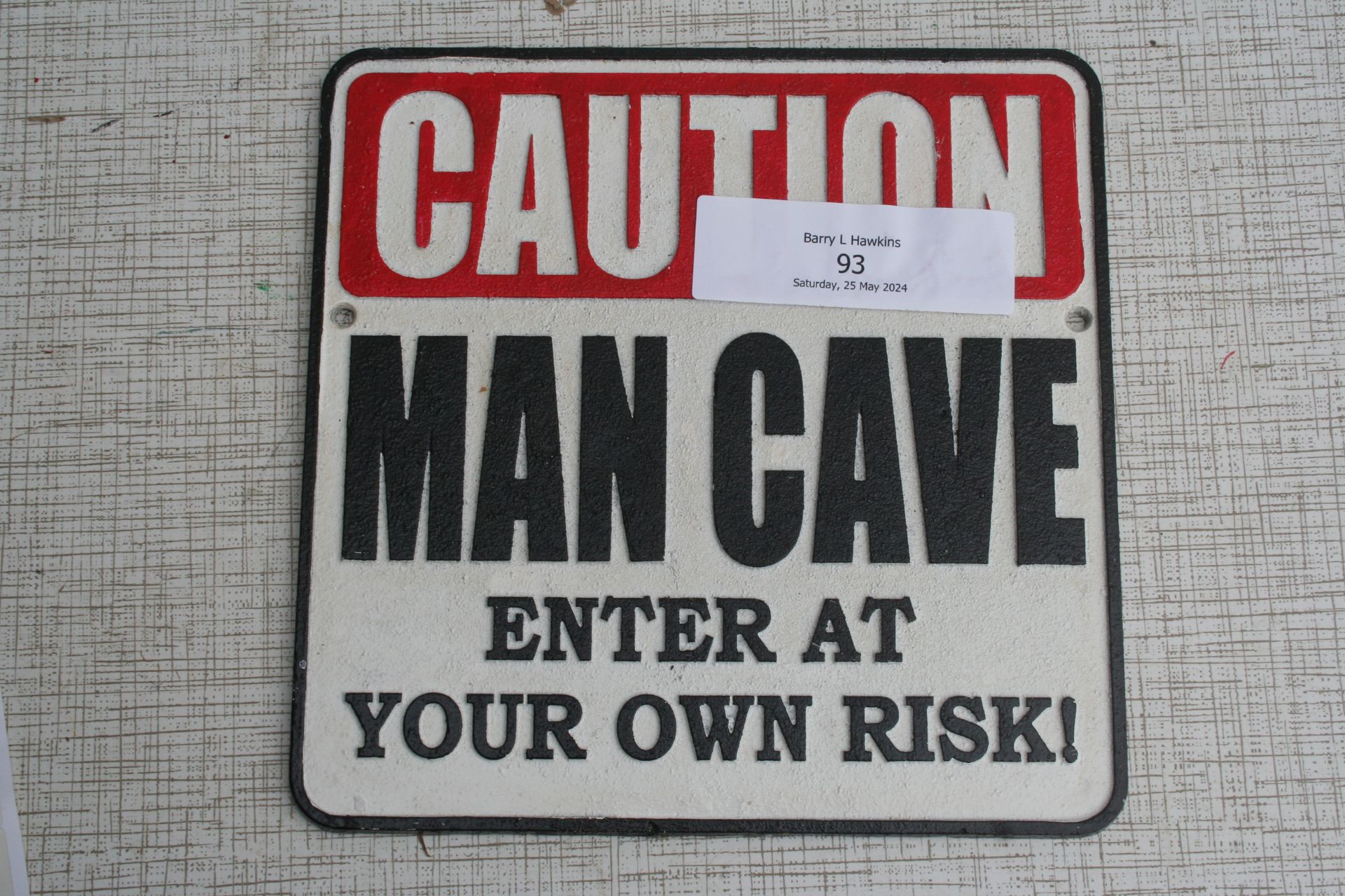 Caution man cave sign